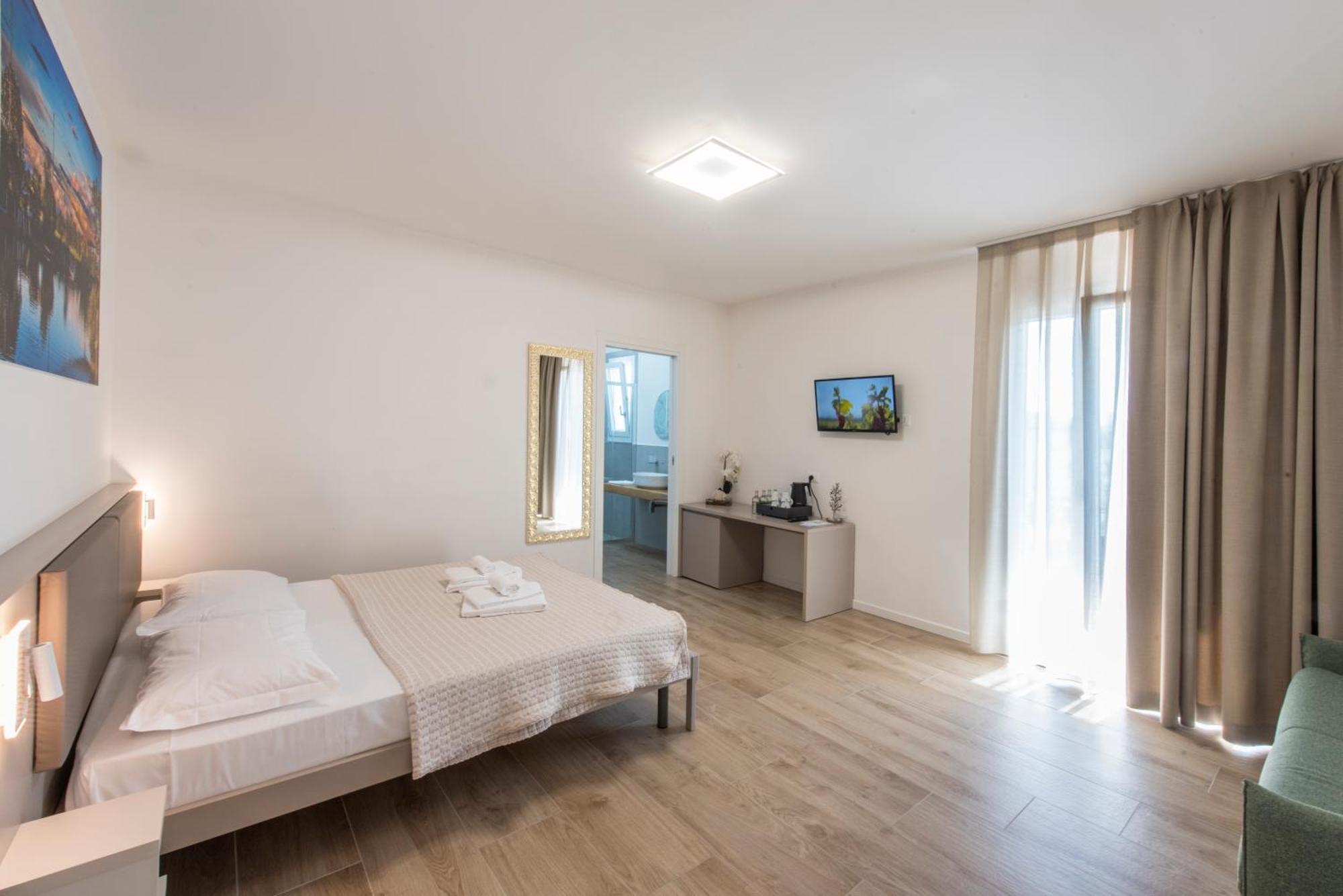 Guesthouse Stadio Lignano Sabbiadoro Bagian luar foto